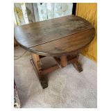 Rustic wooden table with drop leaf sides