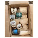 Box full of assorted mugs