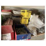 Shelf of assorted anchors screws, washers, and bolts