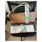 Two keyboards, wireless mouse and a power cord