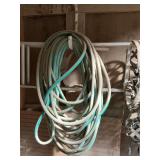 Garden hose with hay bag for horses