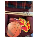 Football and basketball decor with autograph bats