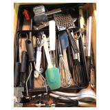 Drawer of assorted kitchen utensils