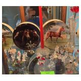 Top shelf of curio cabinet- miniature dolphins, dogs, bears, roosters & horse plates