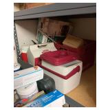 Miscellaneous lunch coolers on third shelf from top