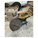 Two plastic tables, extension cord and plastic trashcan