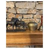 Cowbell, classroom bell, horse statue and candle