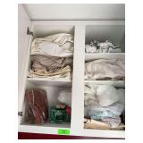 Contents of two upper cabinets in laundry
