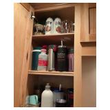 Assorted water bottles and glasses
