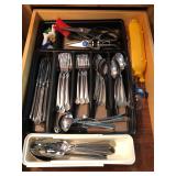 Drawer of silverware and kitchen items