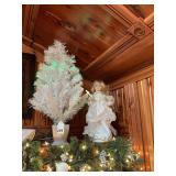 White 20 inch fiber optic tree with angel that moves and lights up.