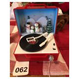 Mini-record player that actually has the record going around and playing Christmas songs and music, vintage