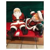 2 large paper Mache Santas just goofing around