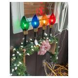4 Jumbo colored bulbs and large strand of lighted garland – screwed to wall