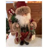 20 inch Santa that is decked out in beautiful Christmas robe ready to party