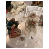 Mary and Joseph w/ baby Jesus figurines Praying hands crystal bell, and an angel.