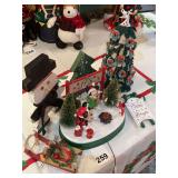 Mickey and Minnie Mouse playing Noel, lighted action figures with sleds and a real nice Christmas tree