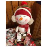 Vintage young Snowman enjoying sledding for Christmas