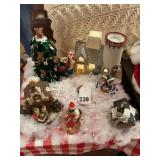 Village scene with lighted house and various figurines