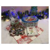Glass Christmas tree candy dish filled with glass beads, Christmas hot pad and a Ball stadium that screams loud when you reach in for candy and Christmas sets of Ear rings for the season. Ear rings ar
