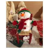 Cool Snowman with wooden chair, pretty cool as he is stuffed with beads and is Nice cloth, vintage.