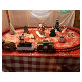 North Pole Central Train Line Track which is attached to a sheet of plywood that is setting on a 6 ft. folding table. This train whistles, bell rings with remote, forward and reverse, table goes with 