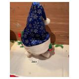 Bear that has a huge hat he lifts up and down while singing deck the halls, very rare and works great