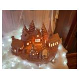 12 piece Mauve Ceramic Christmas village with lights, very exquisite and great for areas where space is a problem. Beautiful when lit up.