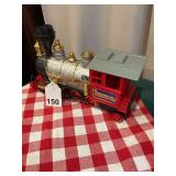 Lighted Christmas locomotive that the wheels spin and spins on the floor