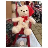 Stuffed Christmas puppy in wooden rocker