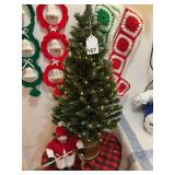 This lot consists of 32 inch fiber optic tree and a real nice snowman plus 4 knitted Christmas stockings and decorations.