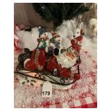 Large fiber optic Santa with kids hanging on to his back sledding, pretty cool w/box