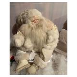 White cloth Santa in white with fancy outfit, this is really old purchased way before 1990.