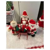 Mr. and Mrs. Knitted Santa Clause a nice sled and a real old Santa Clause that winds-up and plays Christmas music, this is one of a kind, don’t miss out