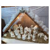 16 piece large white Ceramic manger scene with wooden simulated barn for the scene which is included w/ the Star of Bethleham. This scene and figures are like new, created in the 1970’s.
