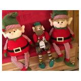 3 Elves with hand made Buttons in the middle and his 2 older twin brothers looking after him.