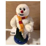 Dancing snowman sings frosty the snowman and twirls his arm around and Around