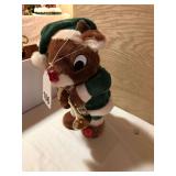 This bear blows his horns and dances playing Christmas songs