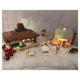 Depot and a Barn House with people playing in the snow