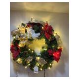 Real great wreath w/lights and ribbon made in 1990 but looks new and a Santa face. You can’t buy this wreath anywhere.