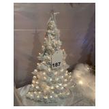 Ceramic lighted Christmas tree that is 18 inches tall and very delicate piece