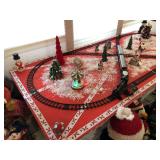 Steam Train fastened to a sheet of plywood with all decorations included, which 2 of those lights up and plays Christmas music, the table it sets on is not included. Will run all day on just 1 battery