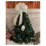 Real nice 32 inch fiber optic tree with nice white deer resting w/box for tree.