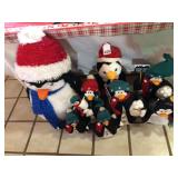 Mr. and Mrs. Christmas Penguin with 6 children all decked out for Christmas