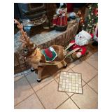 36 inch Reindeer made from cloth and hair that is pulling a 24 inch metal gold sled w/ a stuffed cloth and knitted Santa Clause 58 inches long in total you’ll never find one like this again.