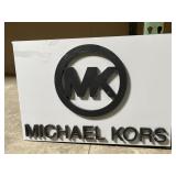 Michael Kors Plastic Sign