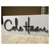 Cole Haan Plastic Sign