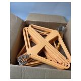 Box Full of Orange Plastic & Metal Hangers