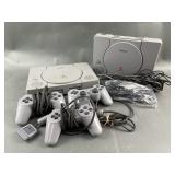 2 Sony PlayStation 1 Consoles w/ 3 Controllers