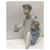 Lladro, boy in nightshirt